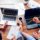 people-sitting-desk-with-laptops-working